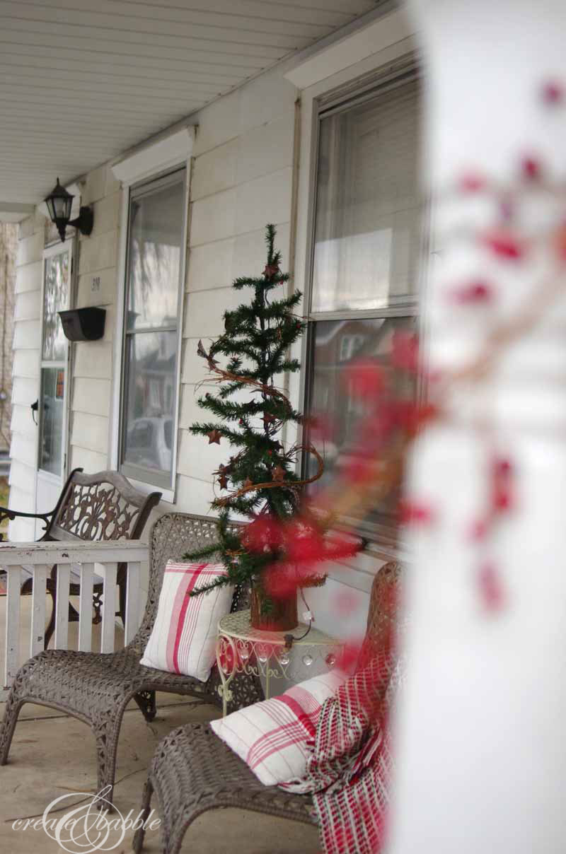 Front Porch Decorated for Christmas {Using a Tablecloth}