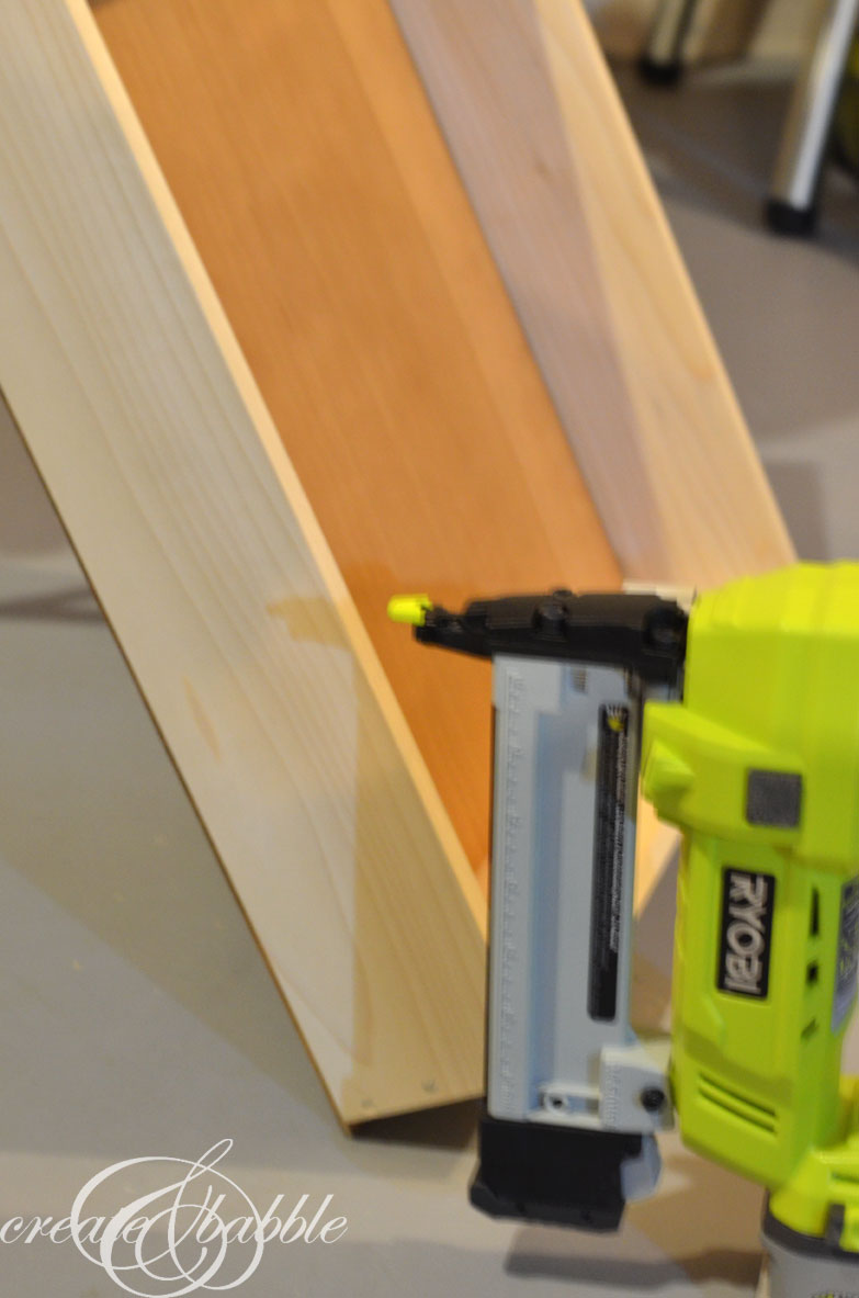 DIY Craft Paint Storage Rack from scrap wood and wire shelves