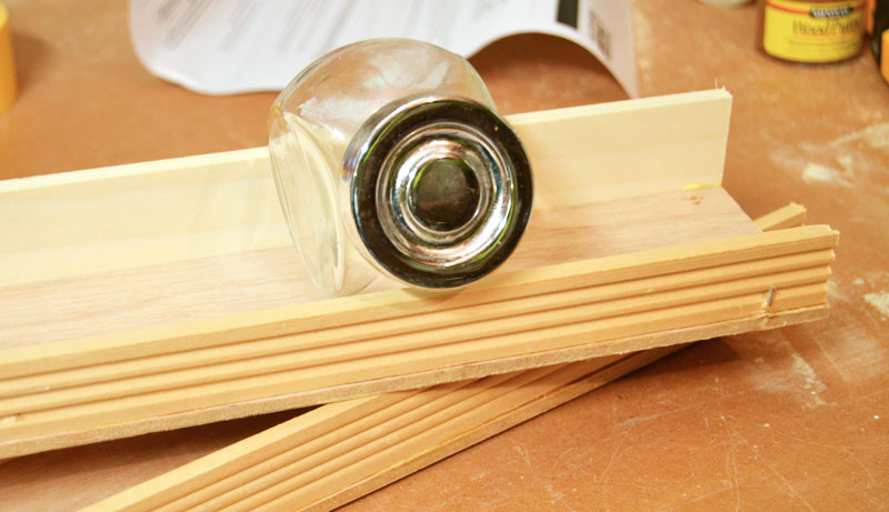 Spice jar on shelf for inside of cabinet door