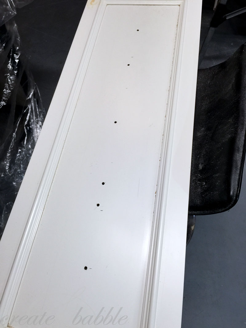 holes drilled in cupboard door upcycle