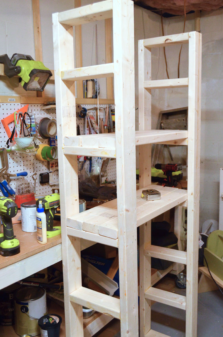 adding-shelves-to-side-frames-of-2-x-4-paint-storage-shelf-made-with-2x4s