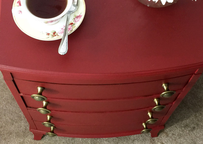 New hardware on red painted chest of drawers