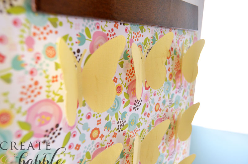 solid colored butterflies on pretty patterned cardstock