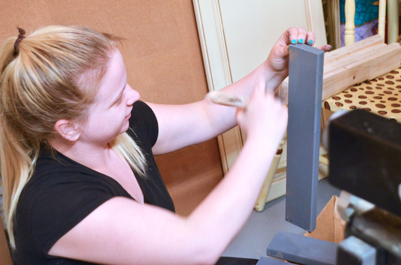 painting slats for bottom shelf before attaching