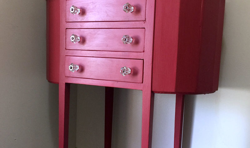 Red painted sewing cabinet