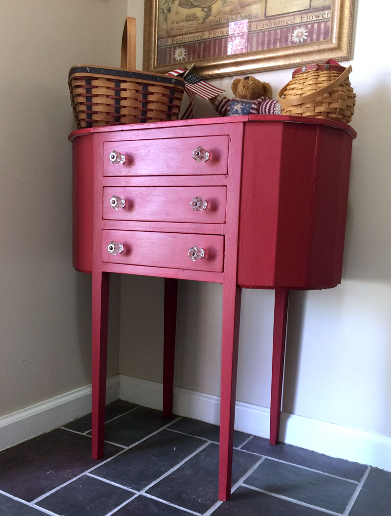 Red painted sewing cabinet