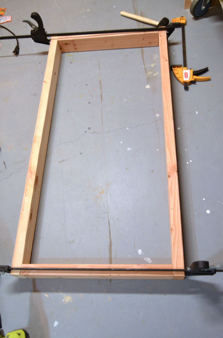 assembled frames using two by fours to make diy corn hole boards