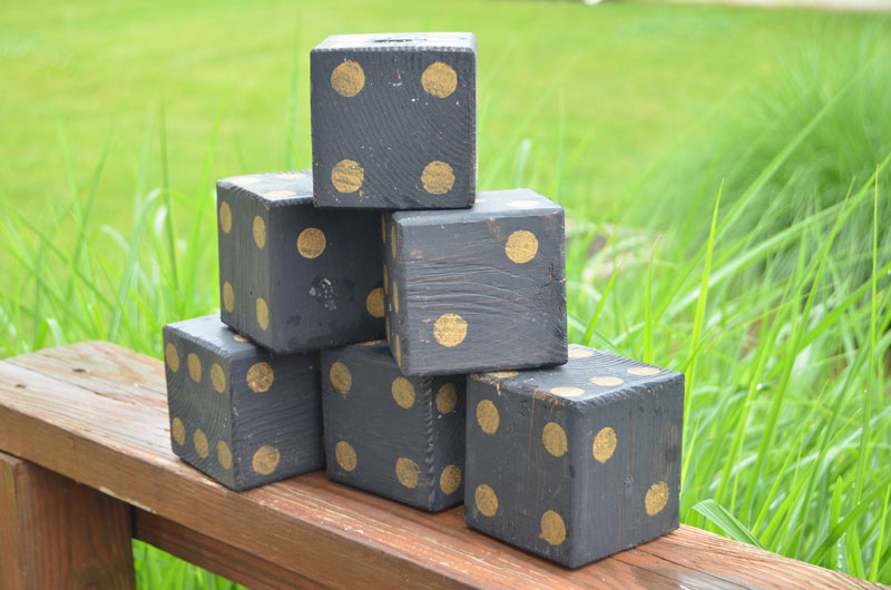 black and gold painted lawn dice