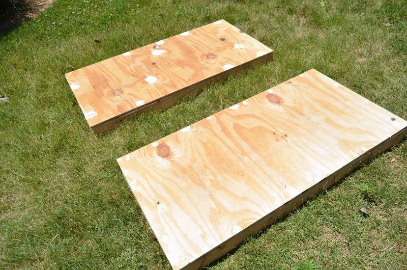 fill holes with wood filler and then sand entire corn hole board