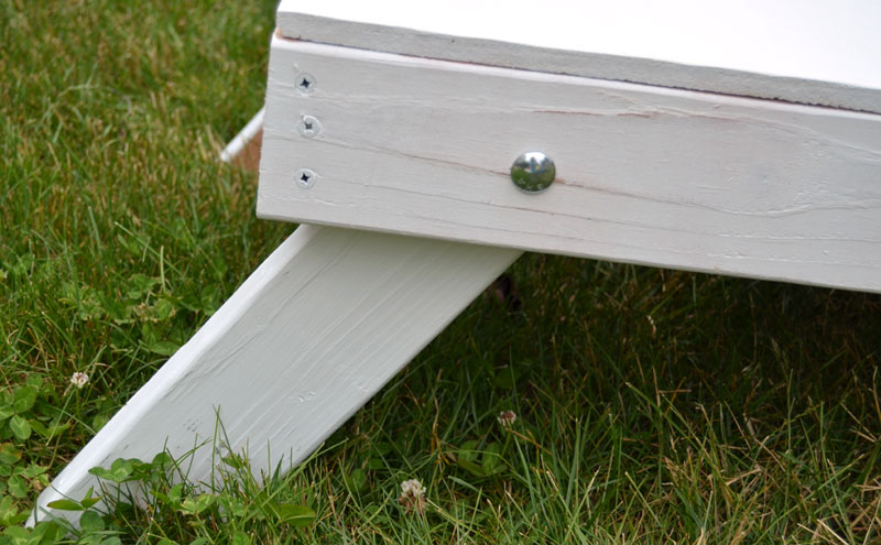 close-up-of-leg-to-corn-hole-board