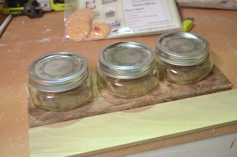 homemade flower box holding mason jars