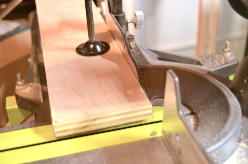 Cut wood into squares with miter saw