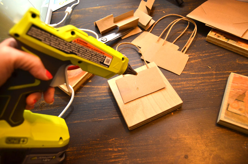 hot-glue-bag-handles-onto-back-of-photo-blocks-for-hanging