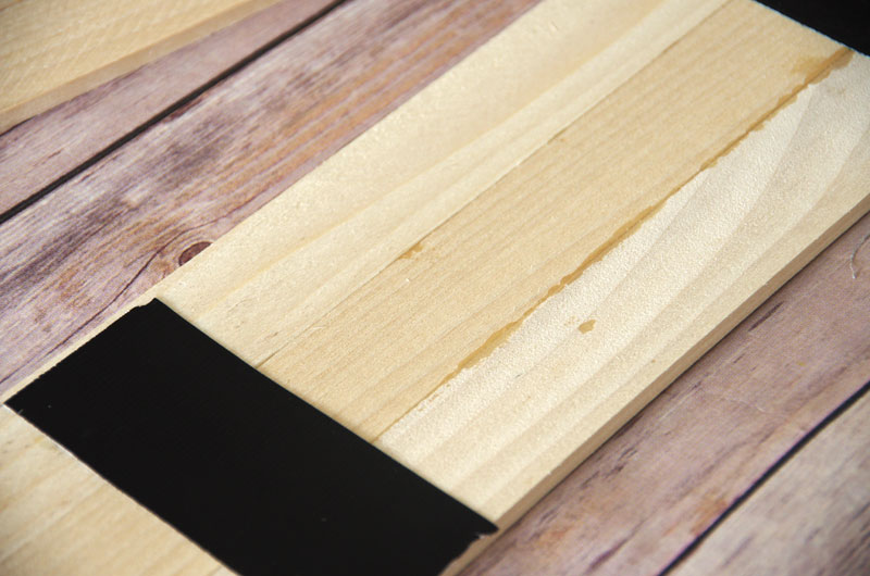 Glue and tape boards together for DIY Wood Plank Sign