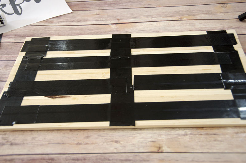 Glue and tape boards together for DIY Wood Plank Sign