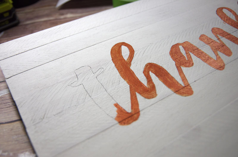 Paint inside lines of traced design on Wood Plank Sign