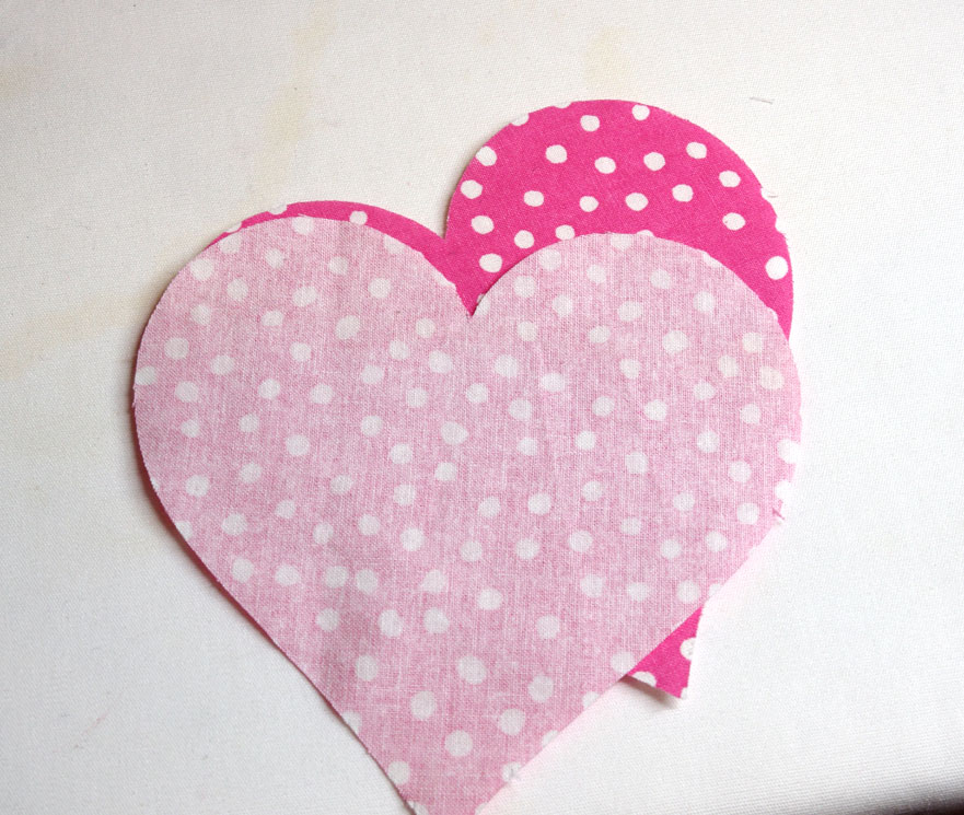 sew heart shapes together to make fabric heart coasters with a cricut