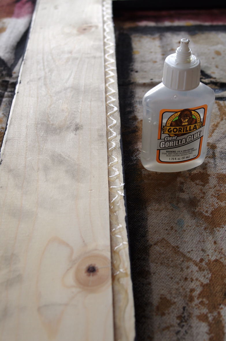 Use gorilla glue to attach sheet metal to wooden frame