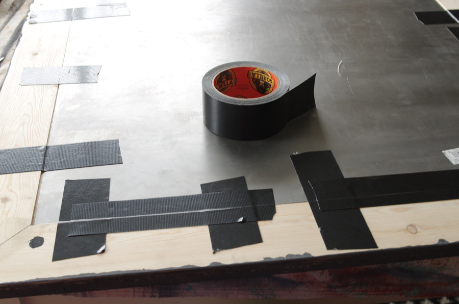 Use gorilla tape to reinforce attachment of sheet metal to wooden frame