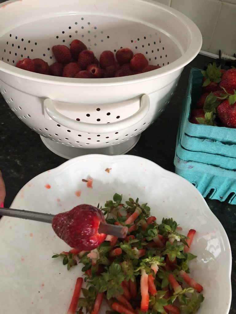 use a straw to hull strawberries