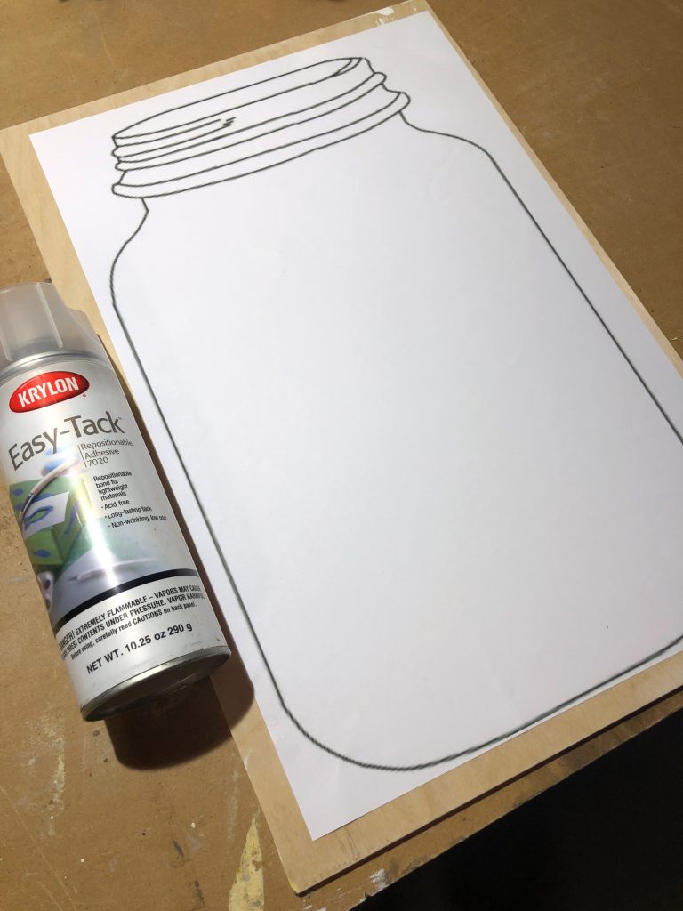 Step-2-Adhere-template-of-mason-jar-onto-plywood-with-repositionable-adhesive