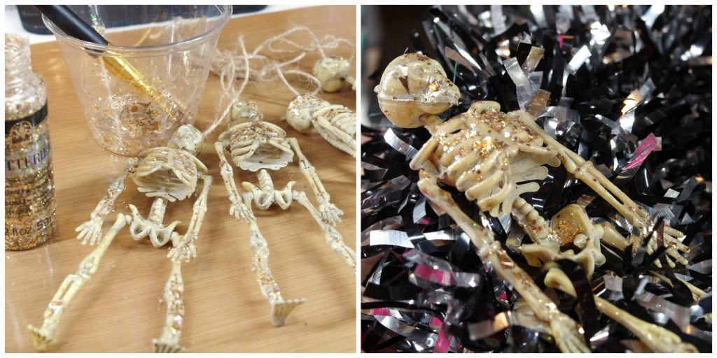 Add glitter to dollar store skeletons for dollar store halloween wreath