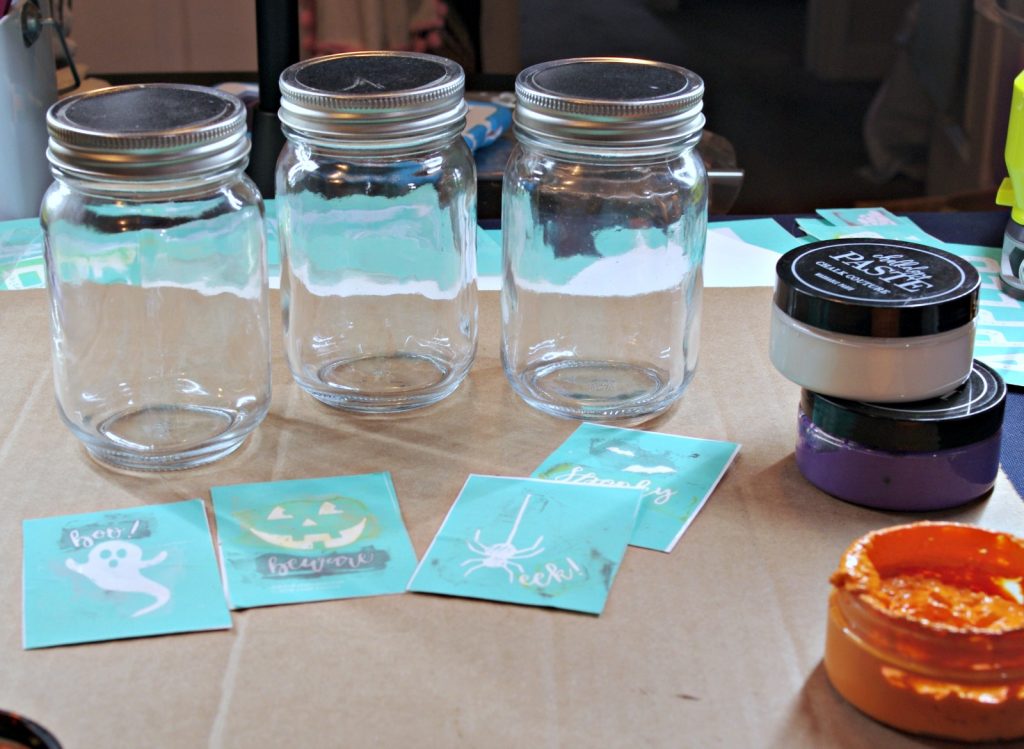 Gather jars, chalk couture transfers and chalk pastes to make easy Halloween Mason Jars