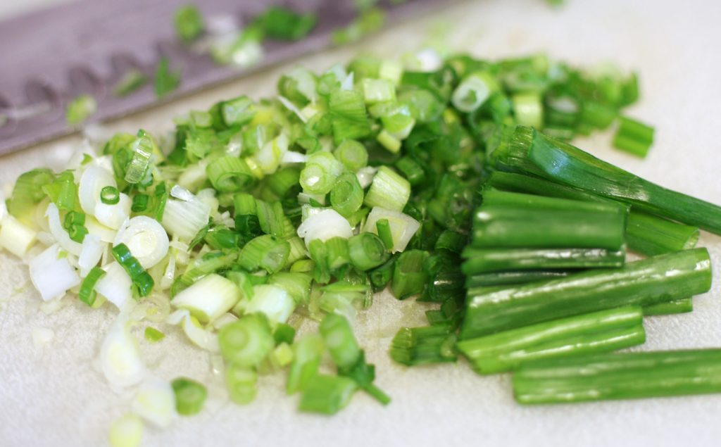 chopped onions for the best ever crab dip recipe